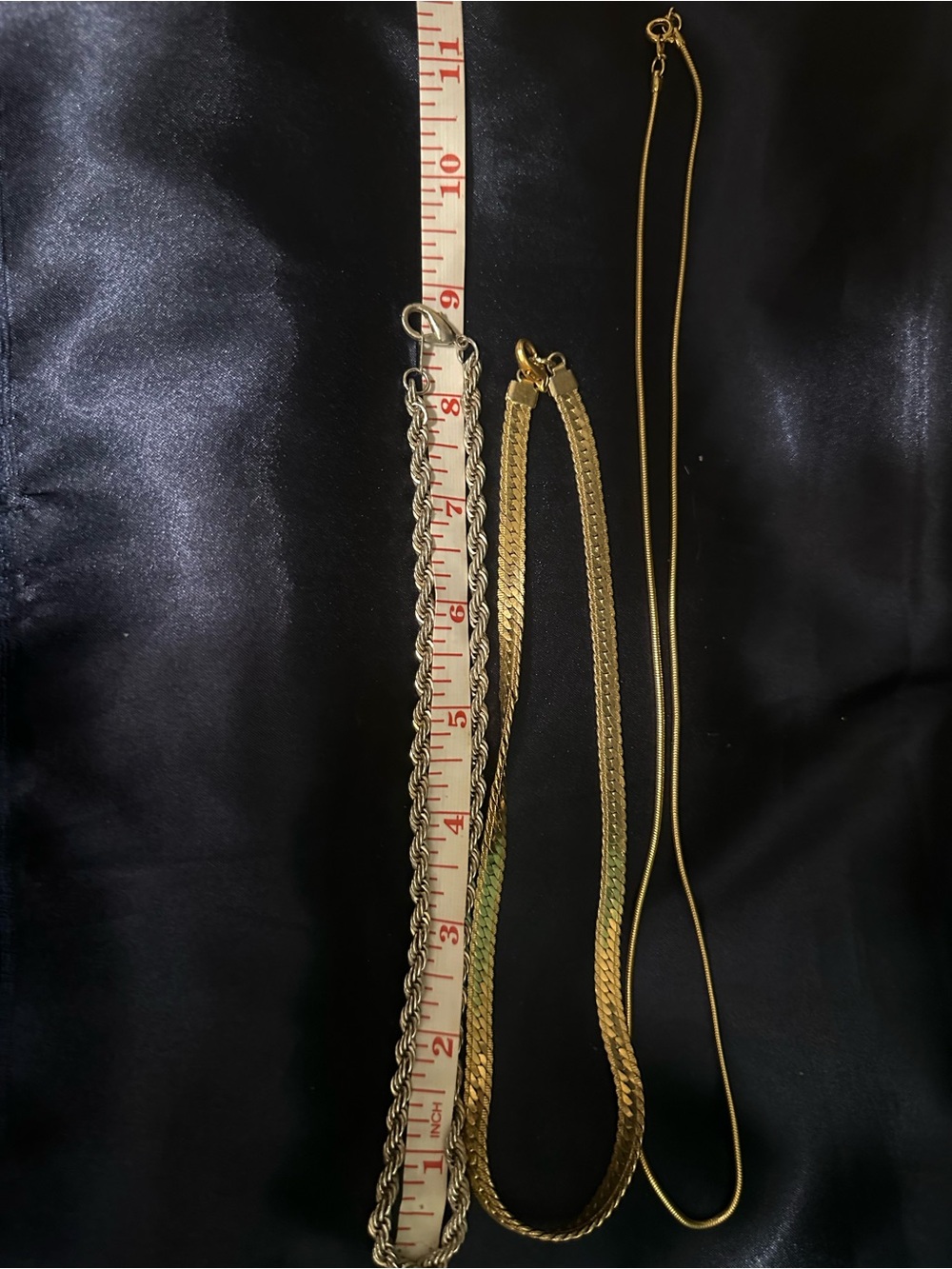 2 Gold Tone and 1 silver toned necklaces.